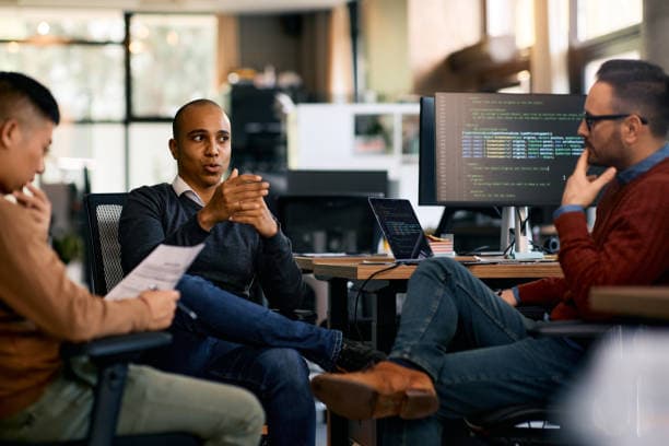 The Paytins team collaborating in a modern office